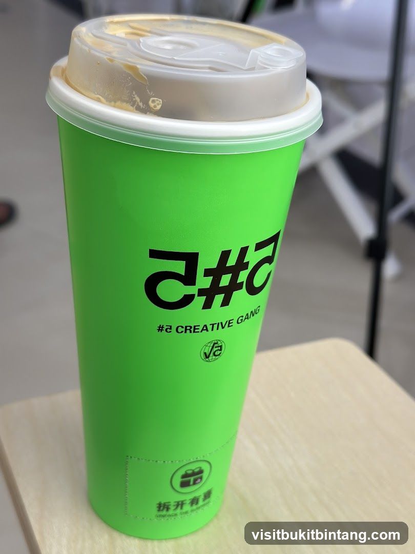 Green cup with logo
