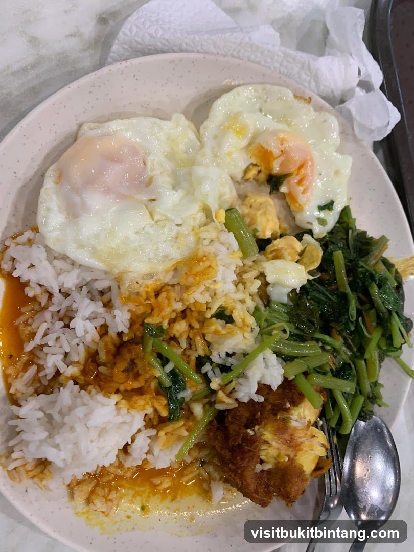 Rice plate with fried eggs and vegetables