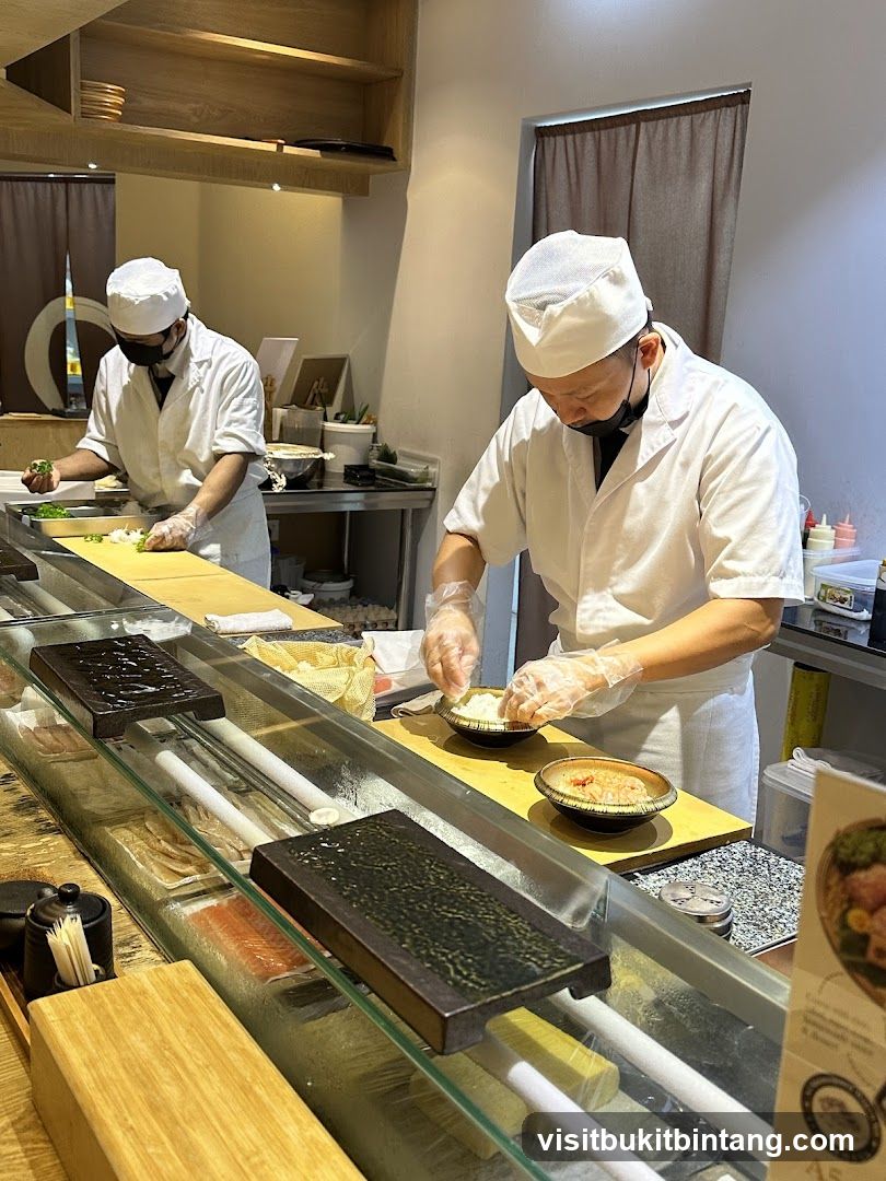 Chefs preparing sushi