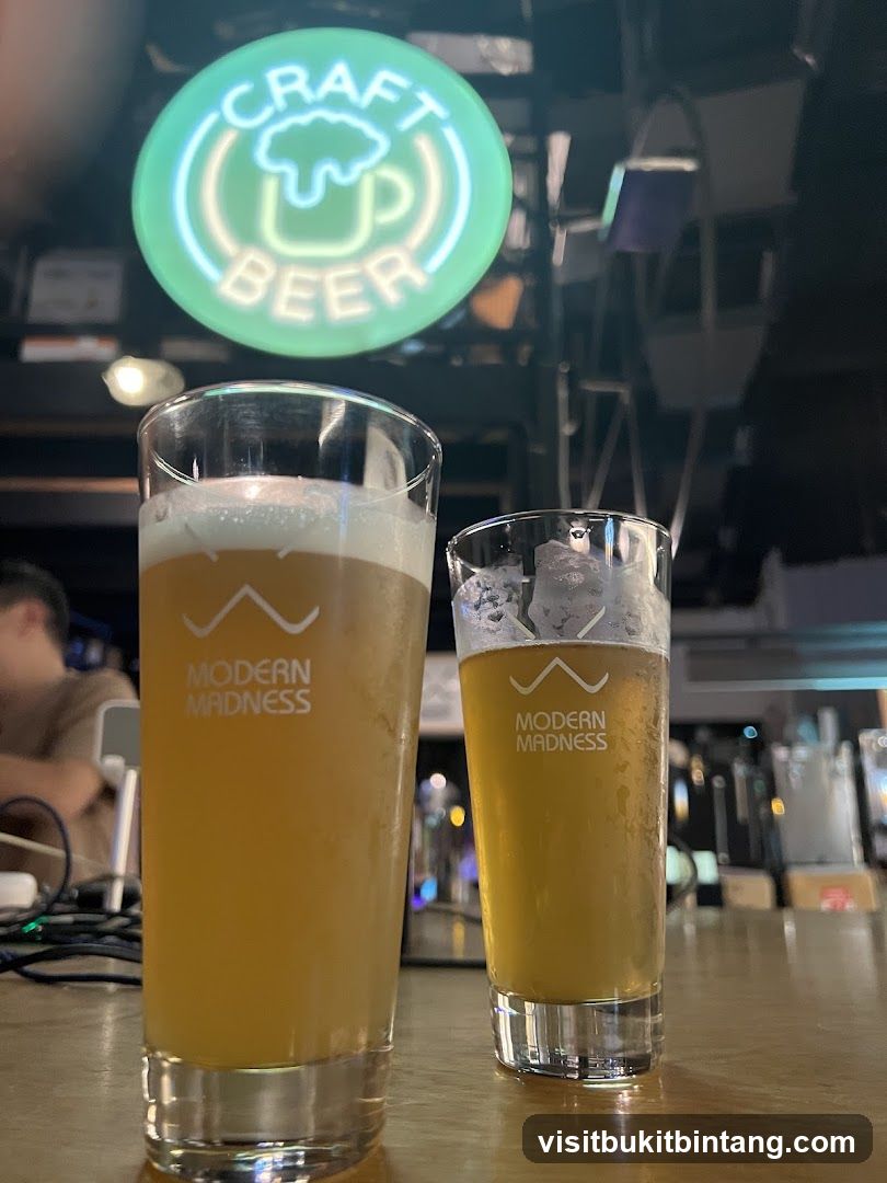 Two glasses of beer on a bar