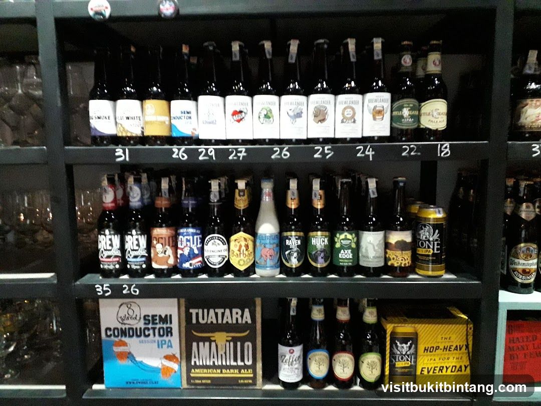 Bottles and cans of beer on shelves