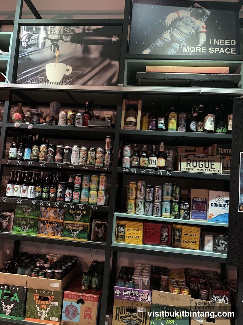 Shelves stocked with beverages and artwork