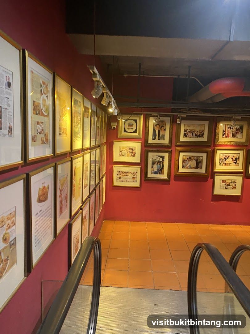 Framed Photos and Articles on a Pink Wall