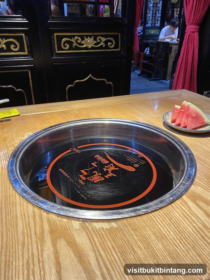 Table Setting with Hot Pot and Watermelon