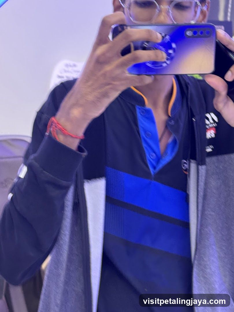 Mirror selfie with phone and glasses