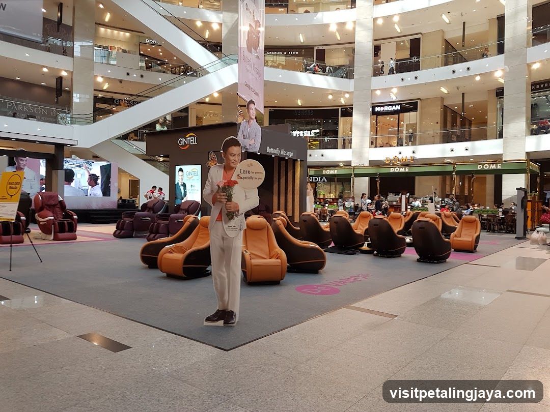 Shopping Mall Interior with Massage Chairs and Advertisements