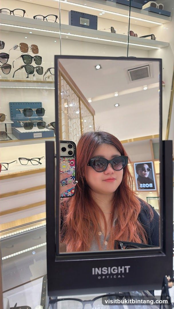 Woman trying on sunglasses