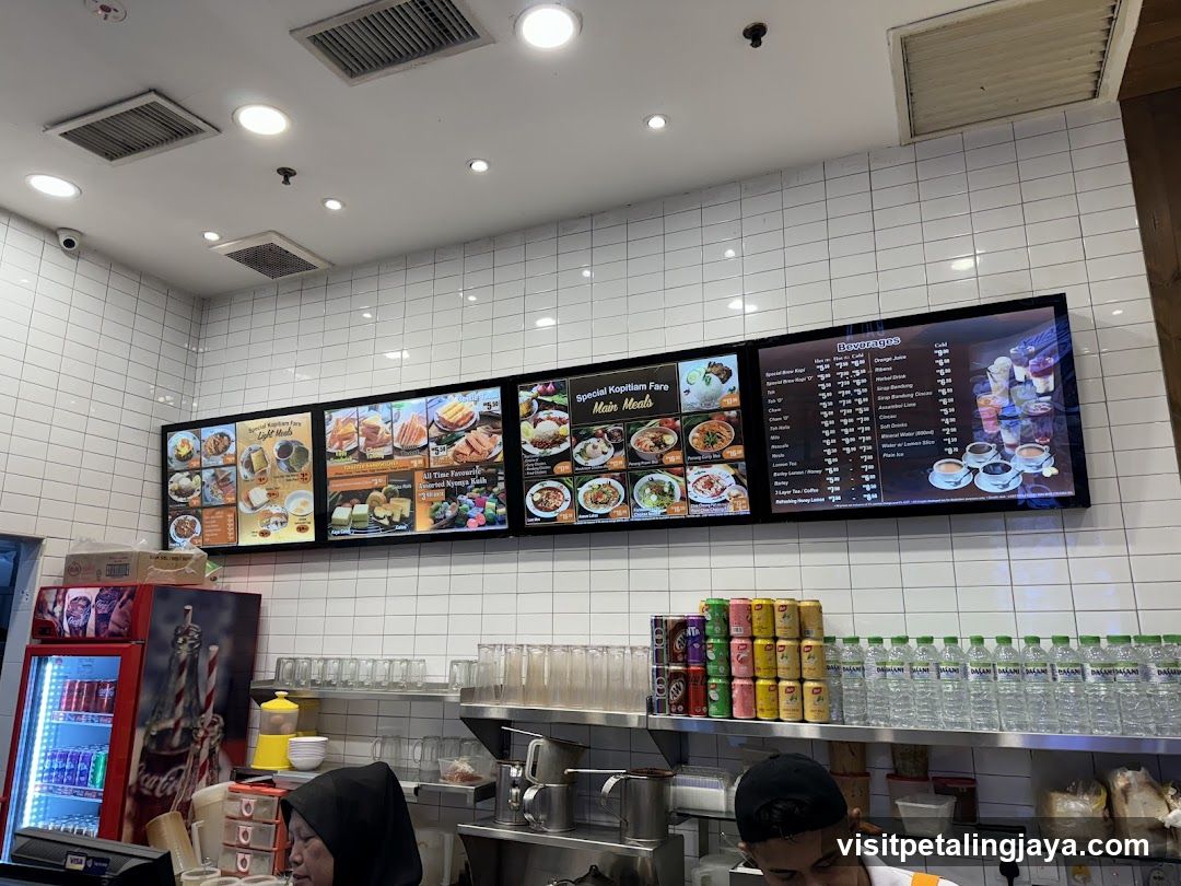 Restaurant Interior with Menu Boards and Staff