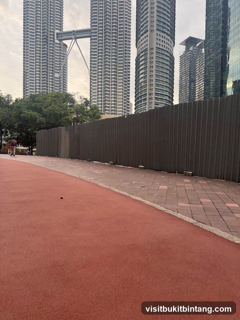 Cityscape with Twin Towers and Construction Barrier