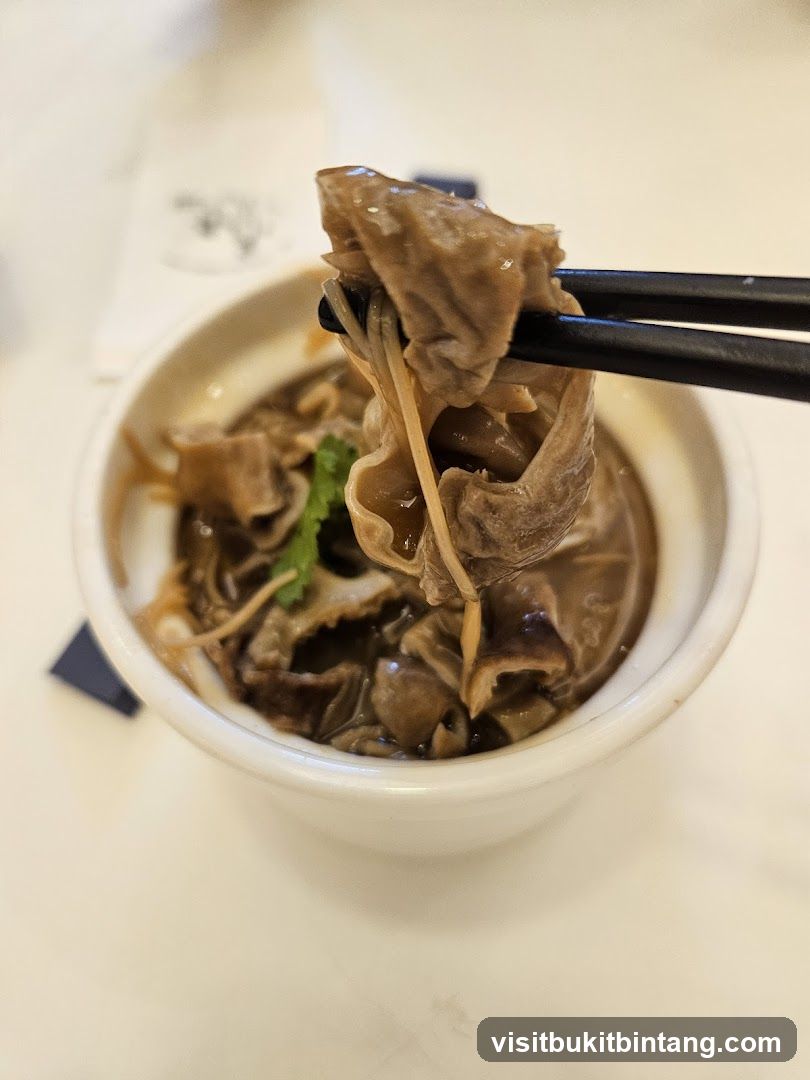 Close-up of Food Being Eaten with Chopsticks