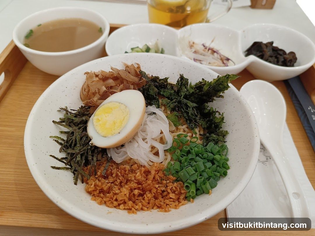 Noodle Dish with Sides and Tea