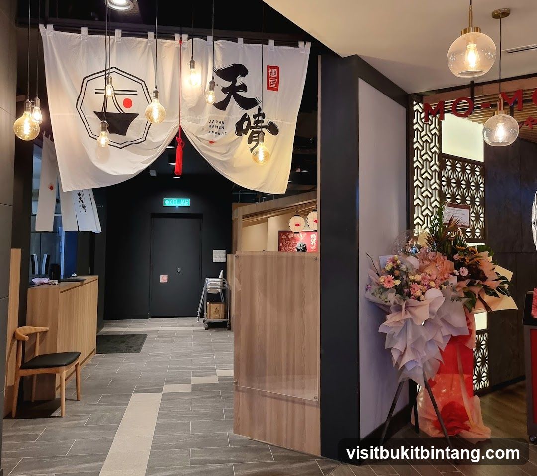 Restaurant Entrance with Noren and Floral Arrangement