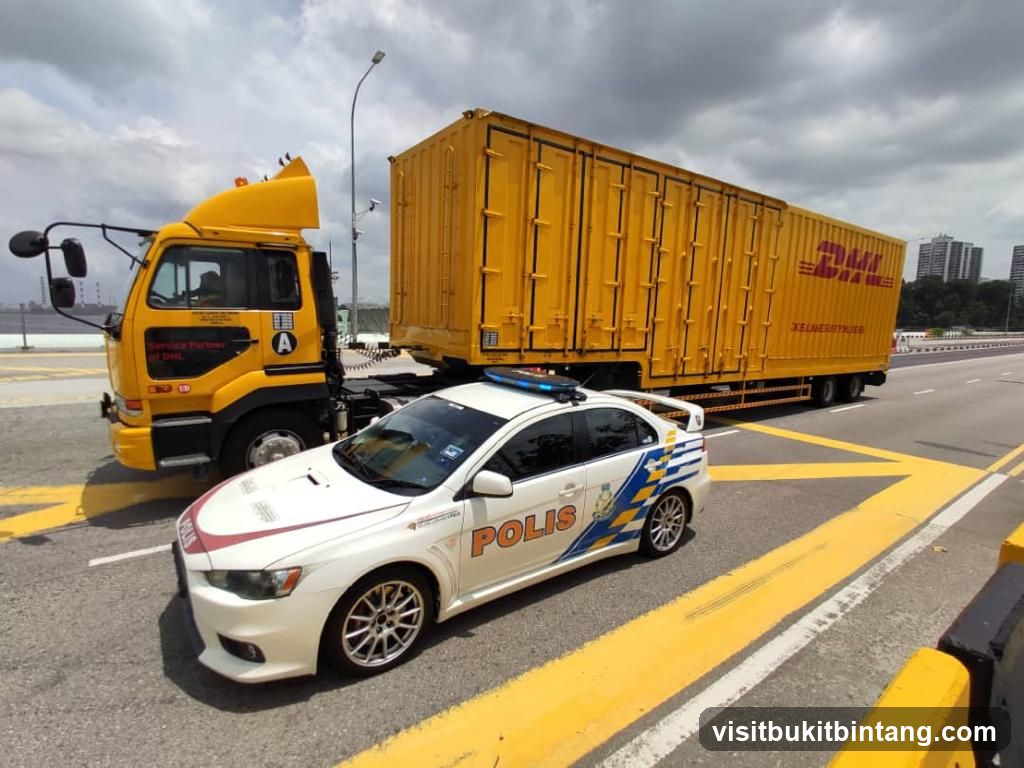 Police Car Escorting DHL Truck