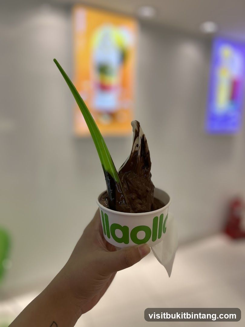 Chocolate frozen yogurt with a green spoon