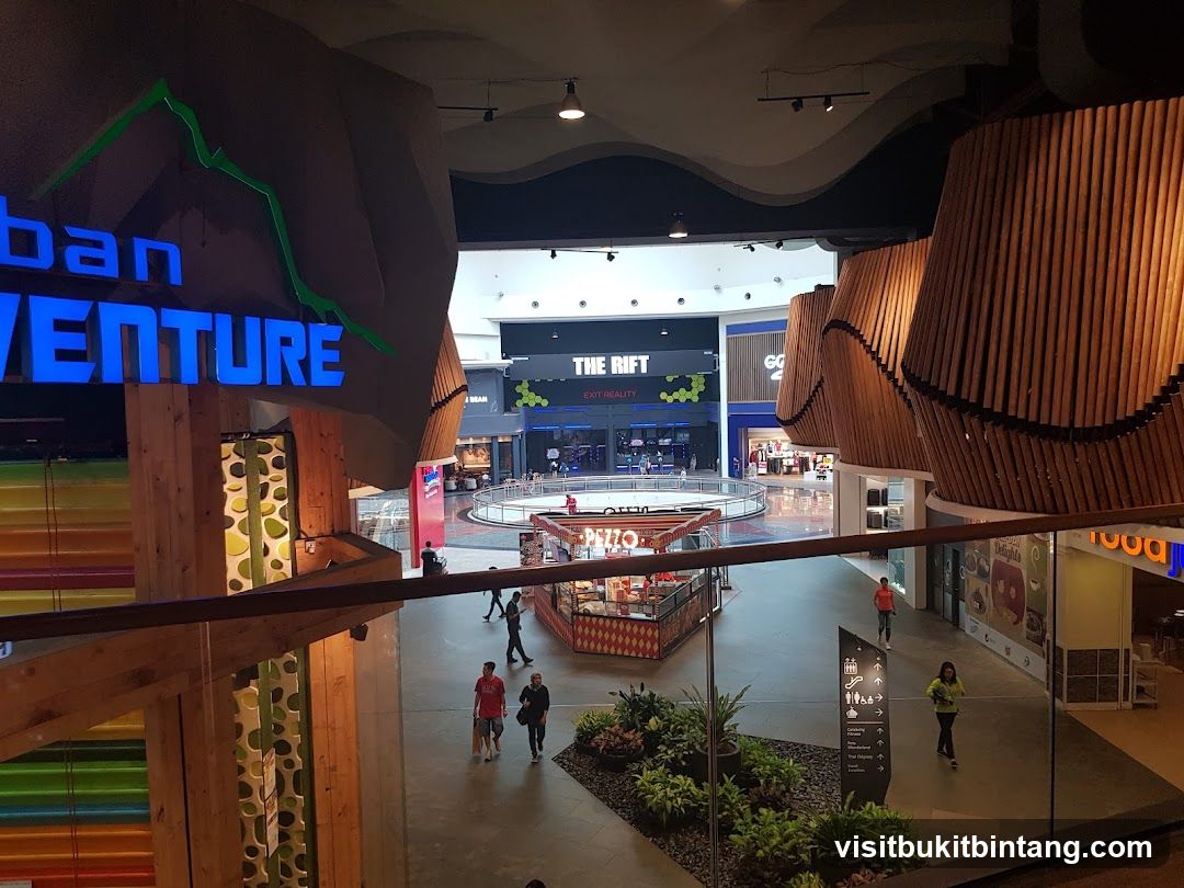 Indoor shopping mall with various stores and attractions