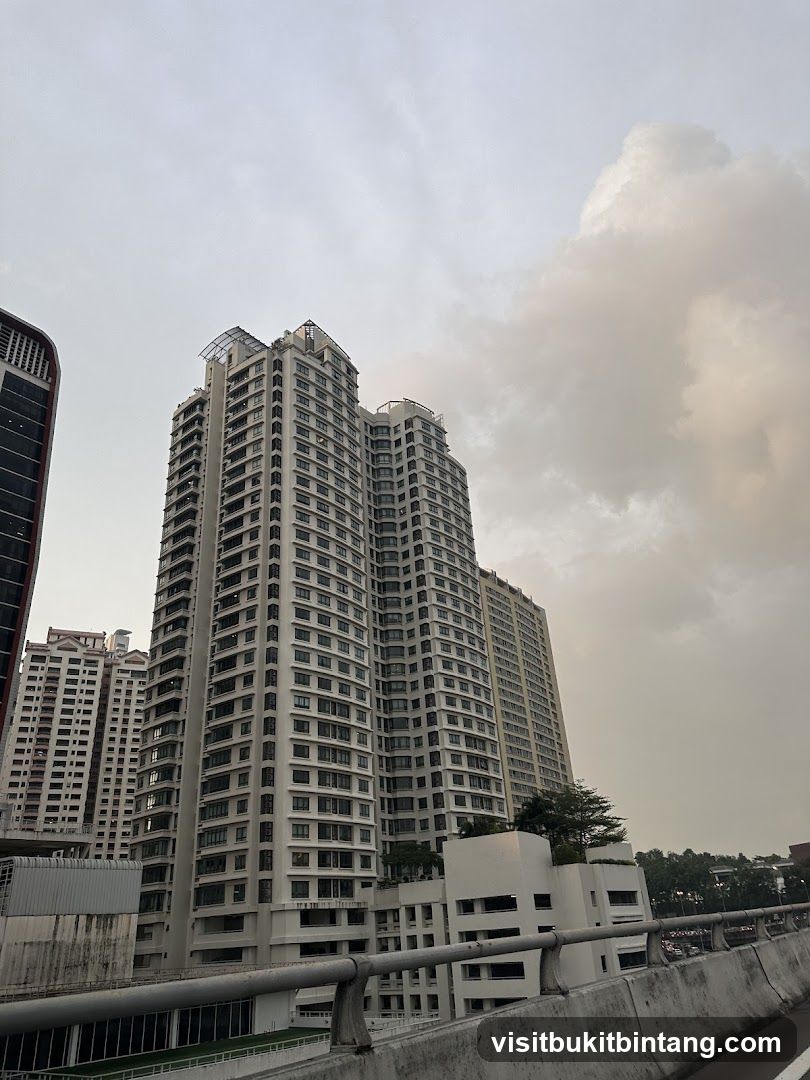 Tall residential buildings under a cloudy sky
