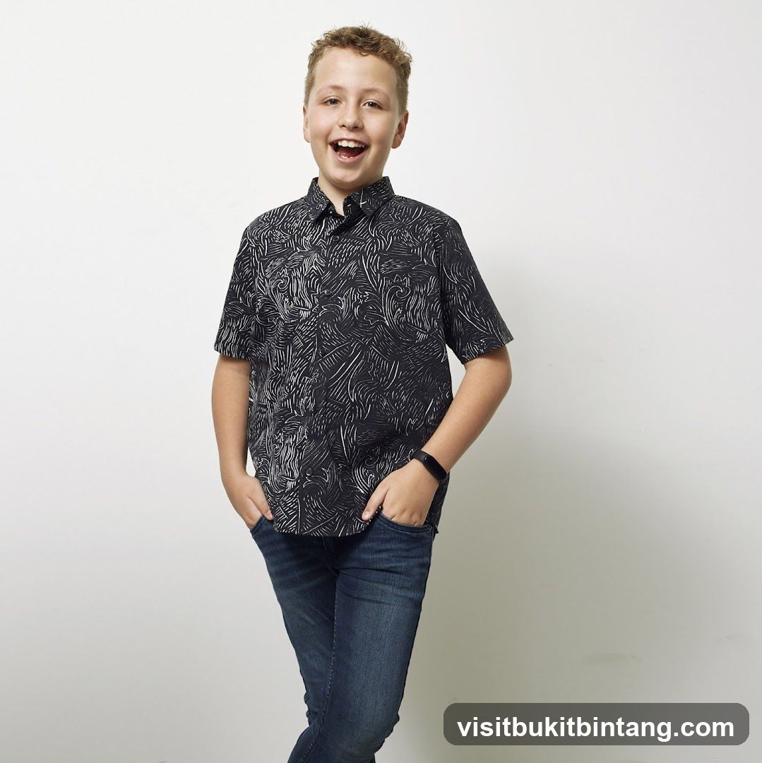 Boy in patterned shirt and jeans