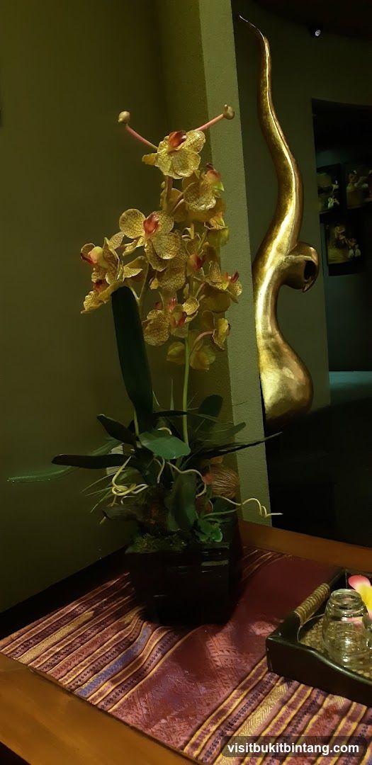 Orchid Arrangement and Decorative Sculpture