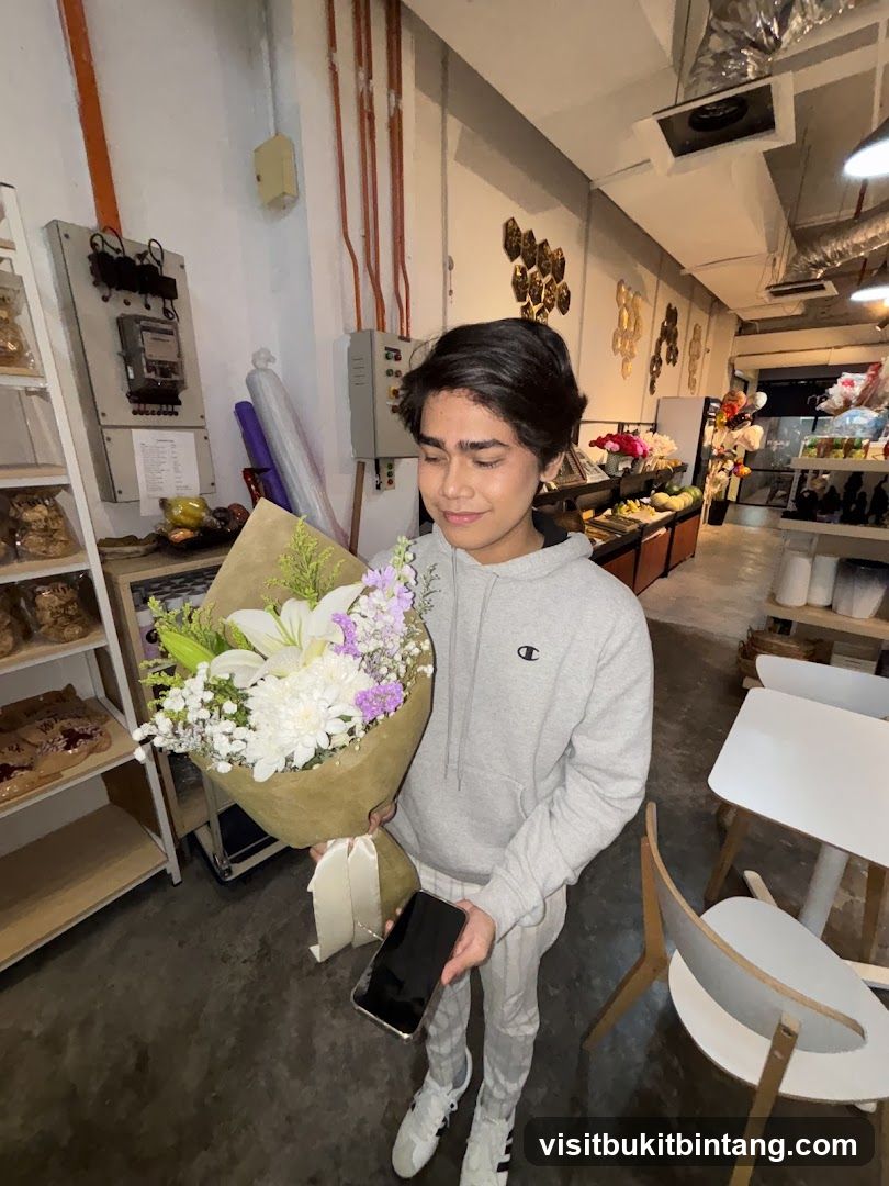 Person holding a bouquet of flowers