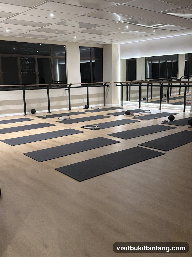 Fitness Studio with Yoga Mats and Barre