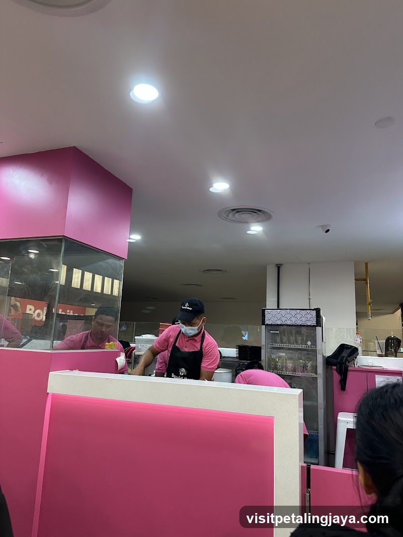 Pink-themed food service counter