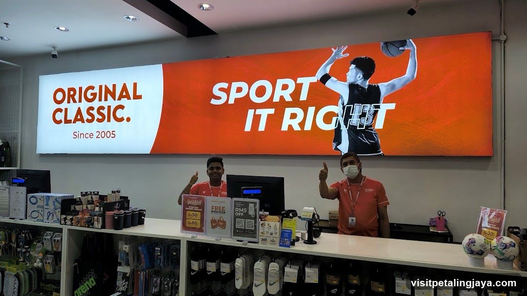 Sports Store Interior with Staff and Signage