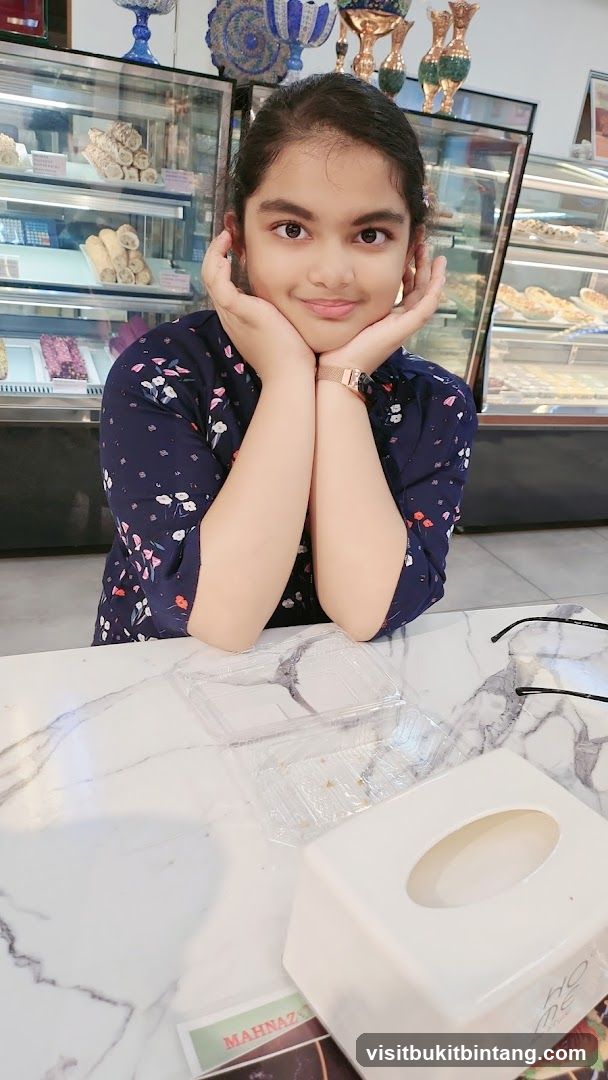 Young girl at a dessert shop