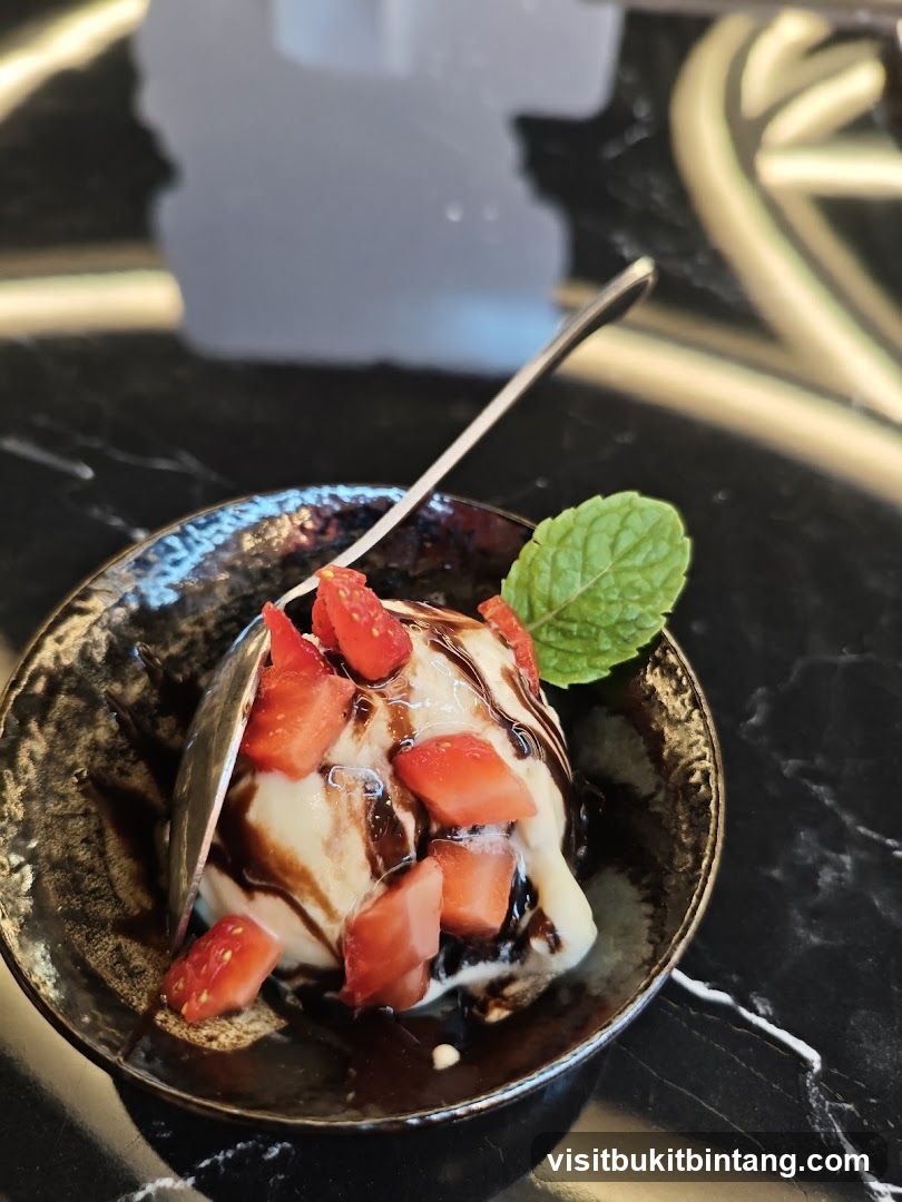 Ice Cream with Strawberries and Chocolate Sauce