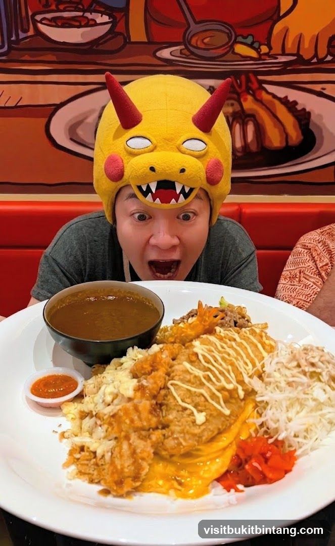 Person wearing a character hat with a large meal