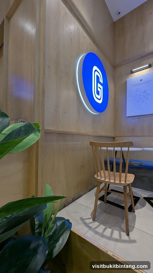 Interior of a cafe with a large illuminated logo
