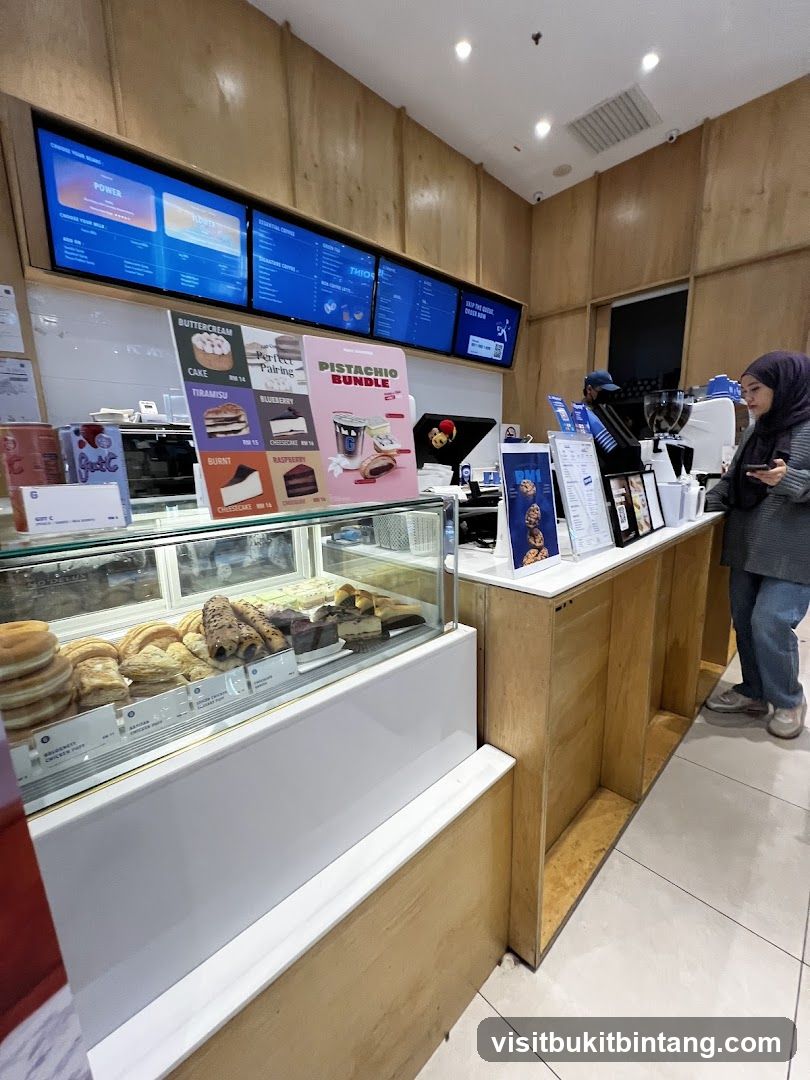 Cafe Interior with Pastries and Digital Menus