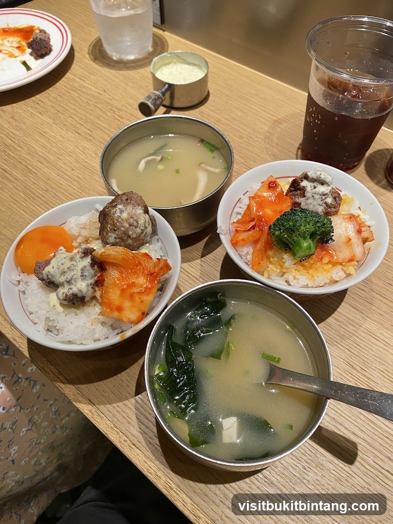 Bowls of rice with toppings and soup