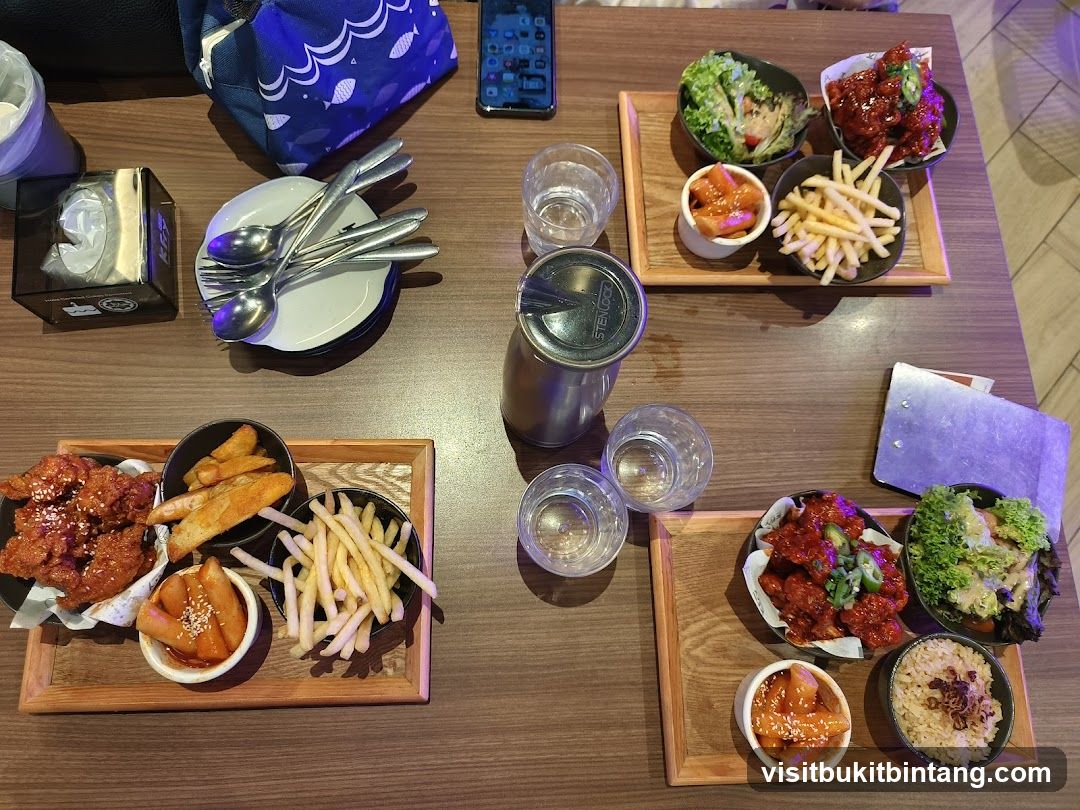Table with Korean Fried Chicken and Sides