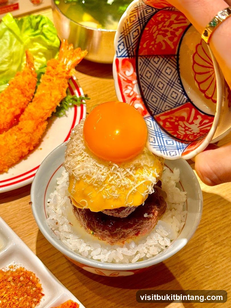 Rice bowl with burger and egg