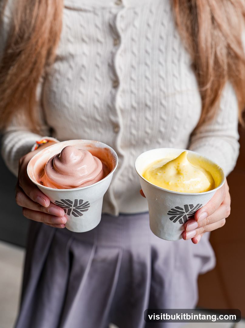 Two cups of soft serve ice cream