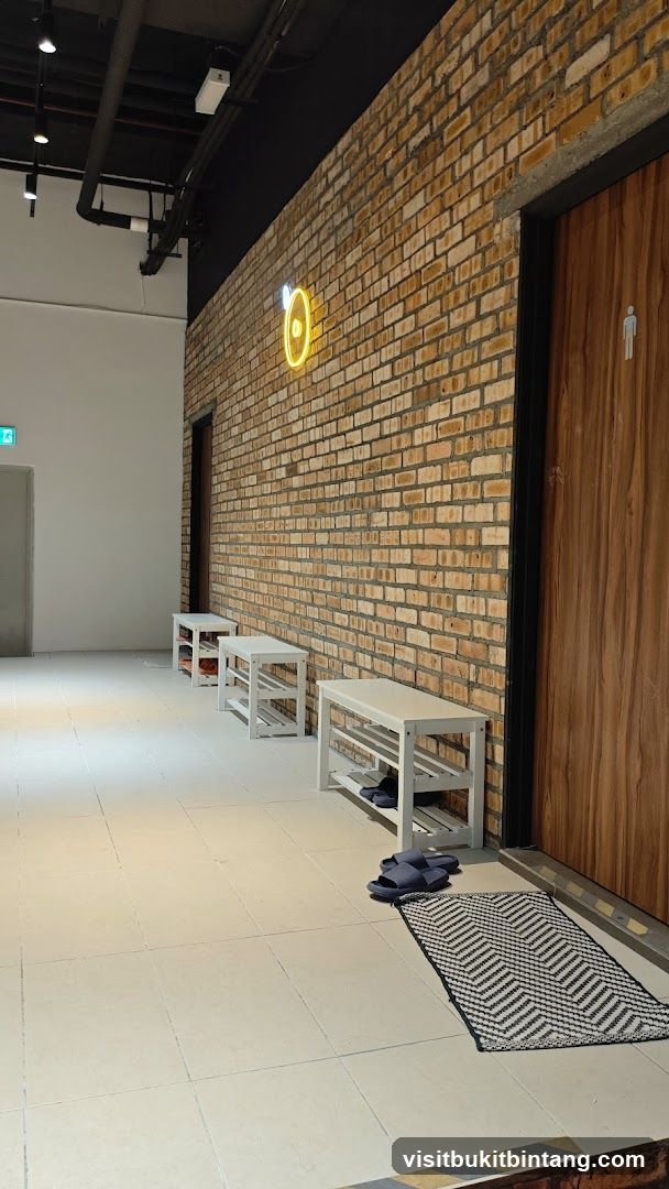 Hallway with Shoe Racks and Neon Sign