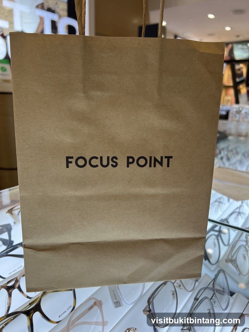 Brown paper shopping bag with "FOCUS POINT" logo