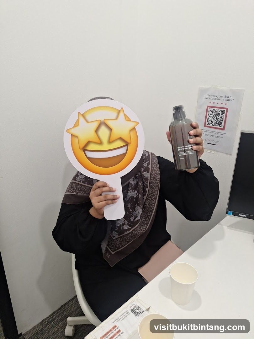 Person holding a bottle and an emoji prop