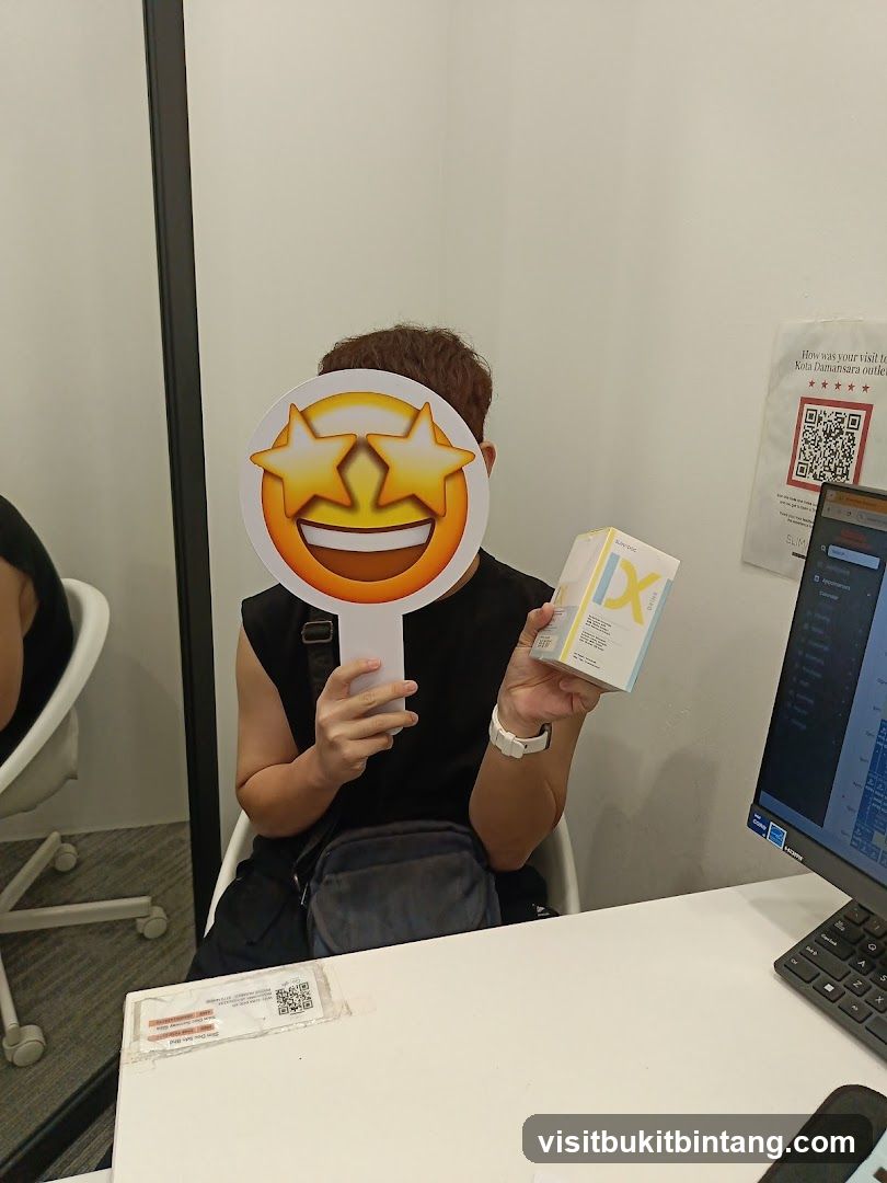 Person holding a product and a smiley face prop