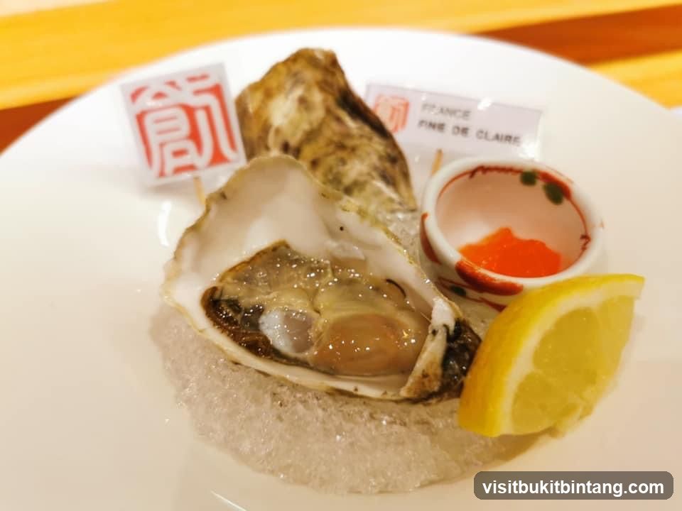 Oyster with lemon and sauce
