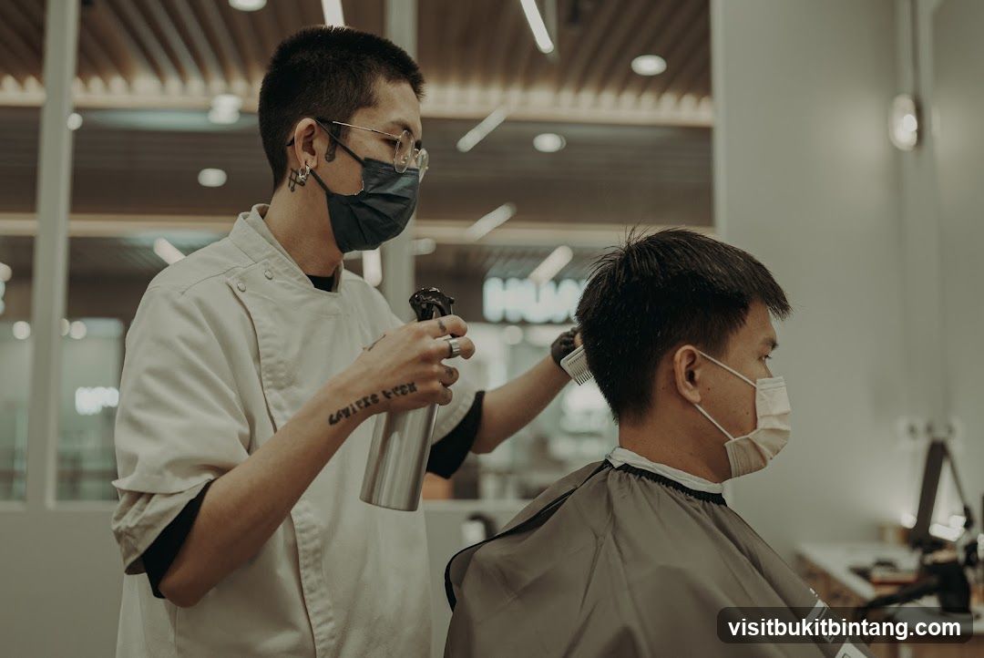 Barber cutting client's hair