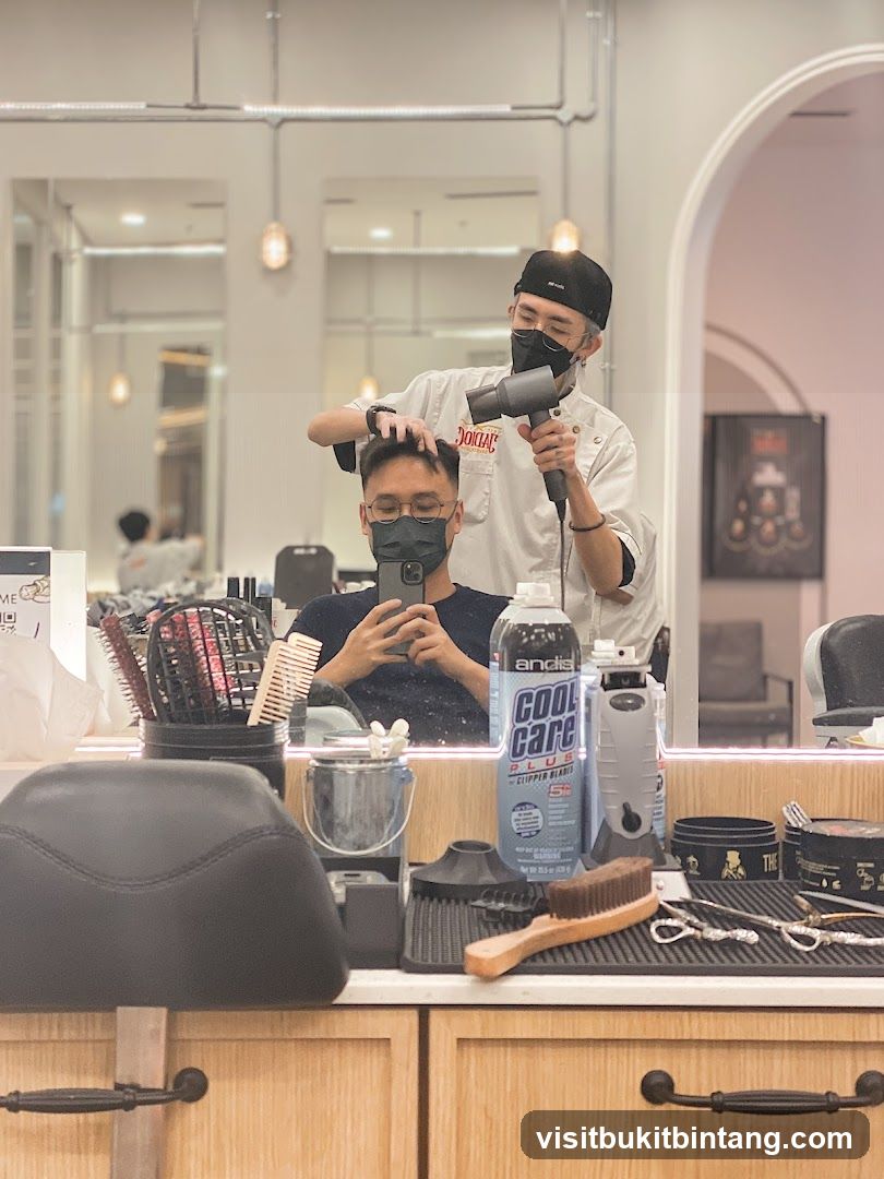 Barber drying client's hair