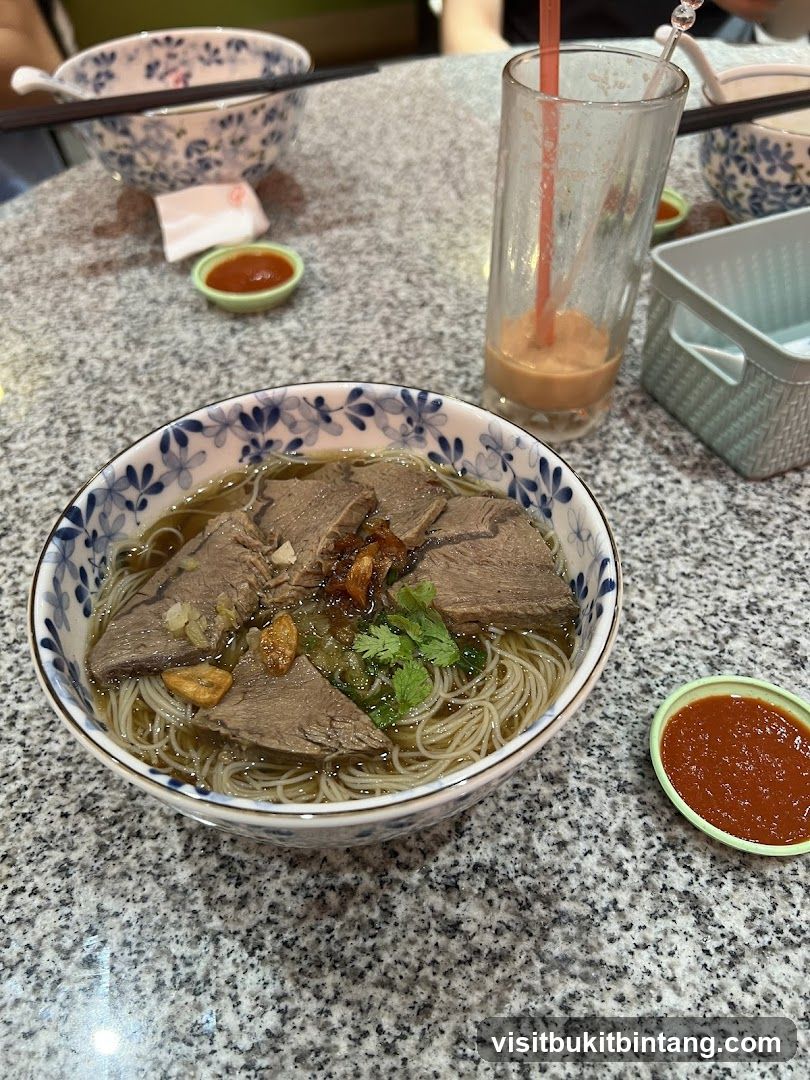 Beef noodle soup with a drink