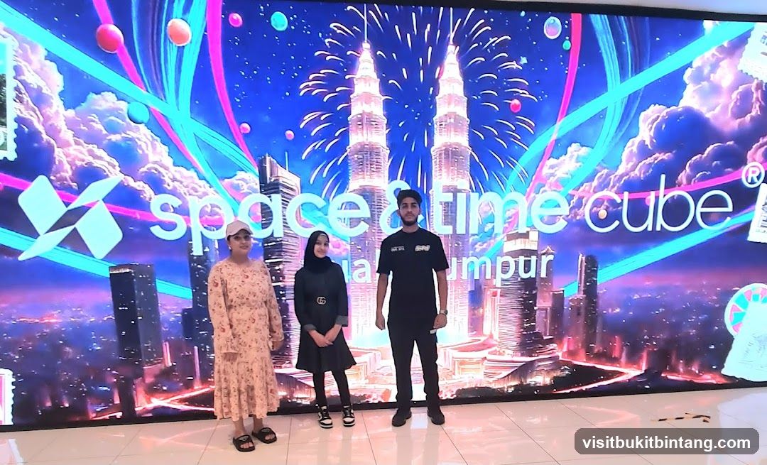 People Posing in Front of a Digital Display