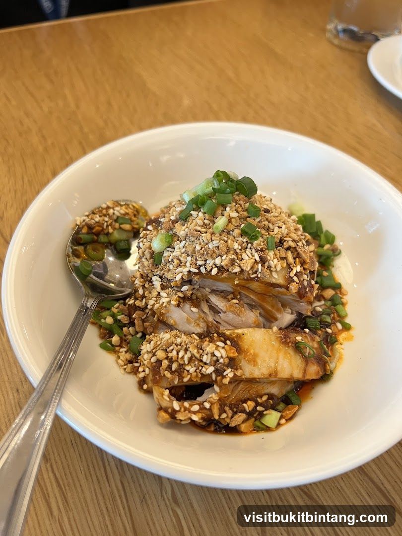Chicken dish with nuts and scallions