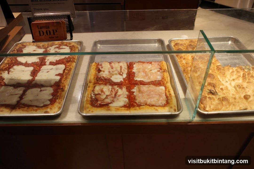 Pizzas and Focaccia in Display Case