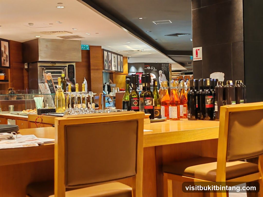 Bar Counter with Wine Bottles and Chairs