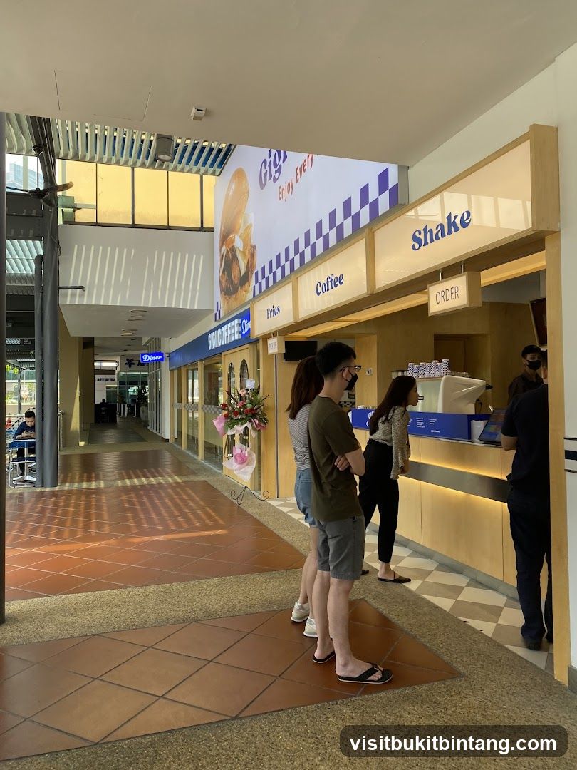 People queuing at a food counter