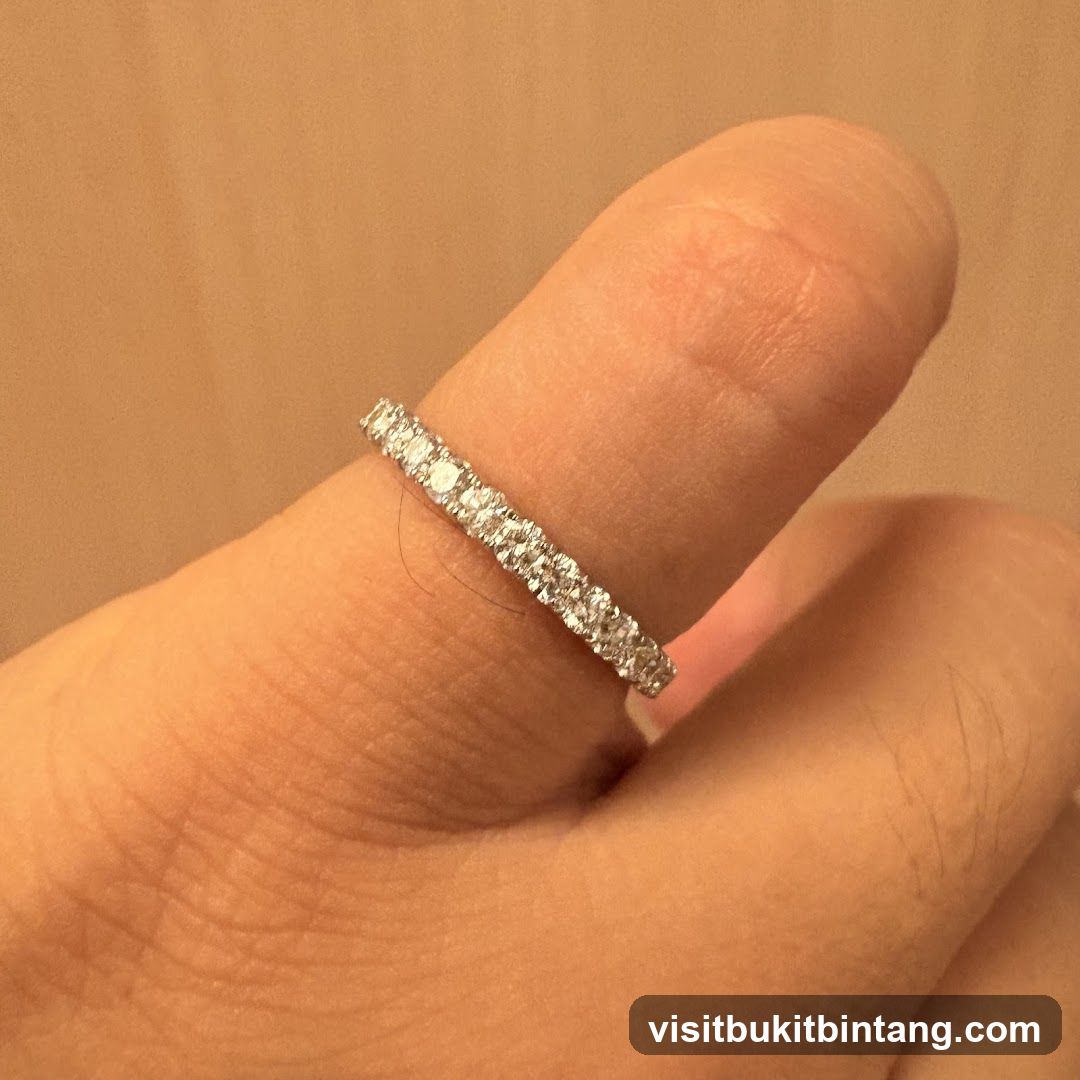 Diamond eternity ring on a finger