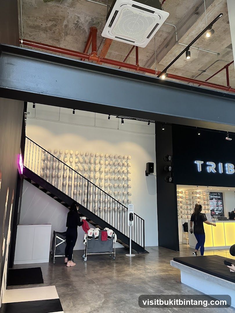 Interior of a gym with a reception desk and workout gear